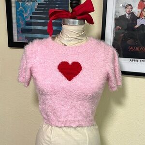 Fuzzy pink sweater with red heart